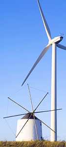 Image: Old Greek windmill next to modern wind turbine